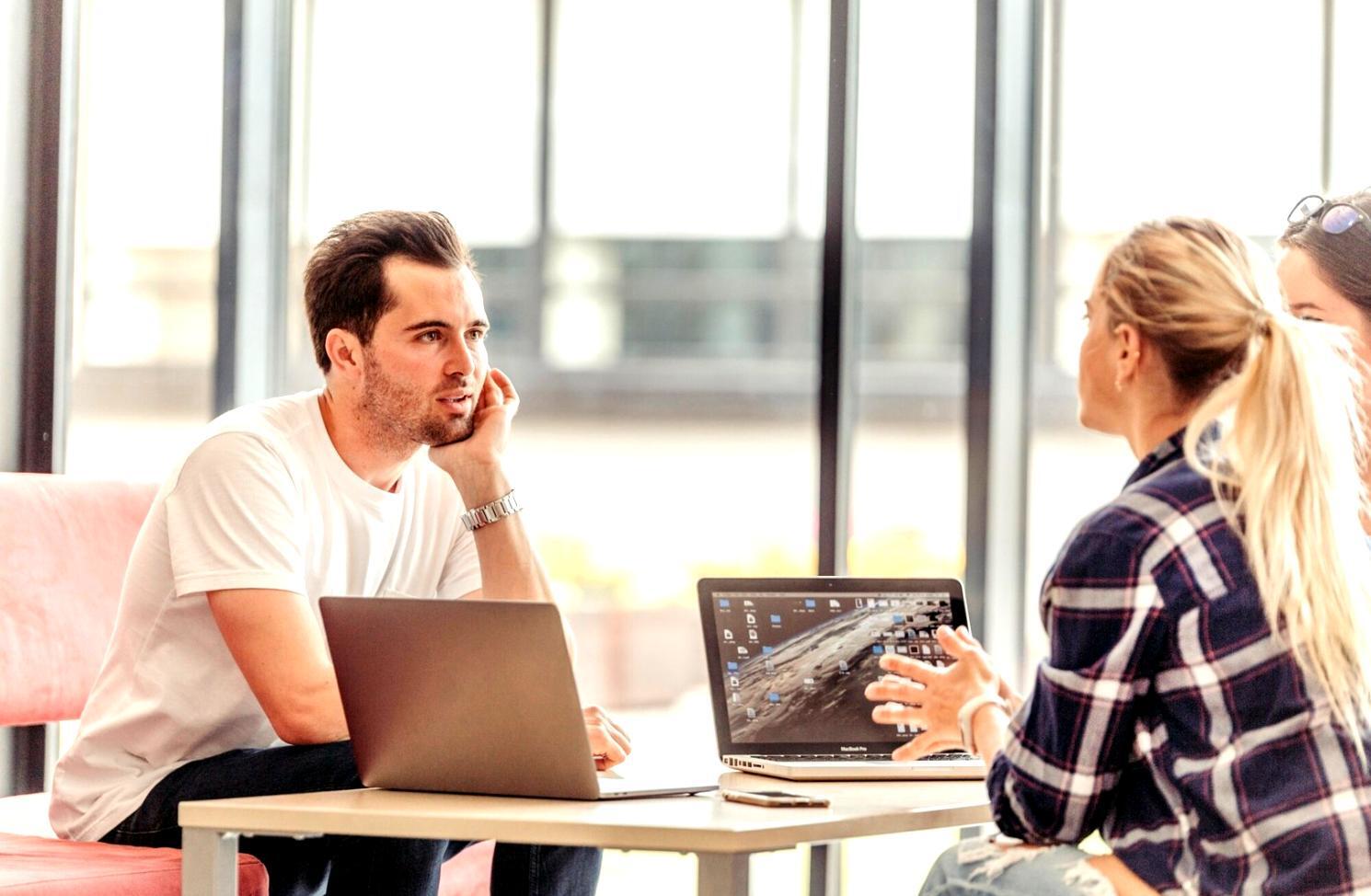 Student working through financial analysis spreadsheets during course session